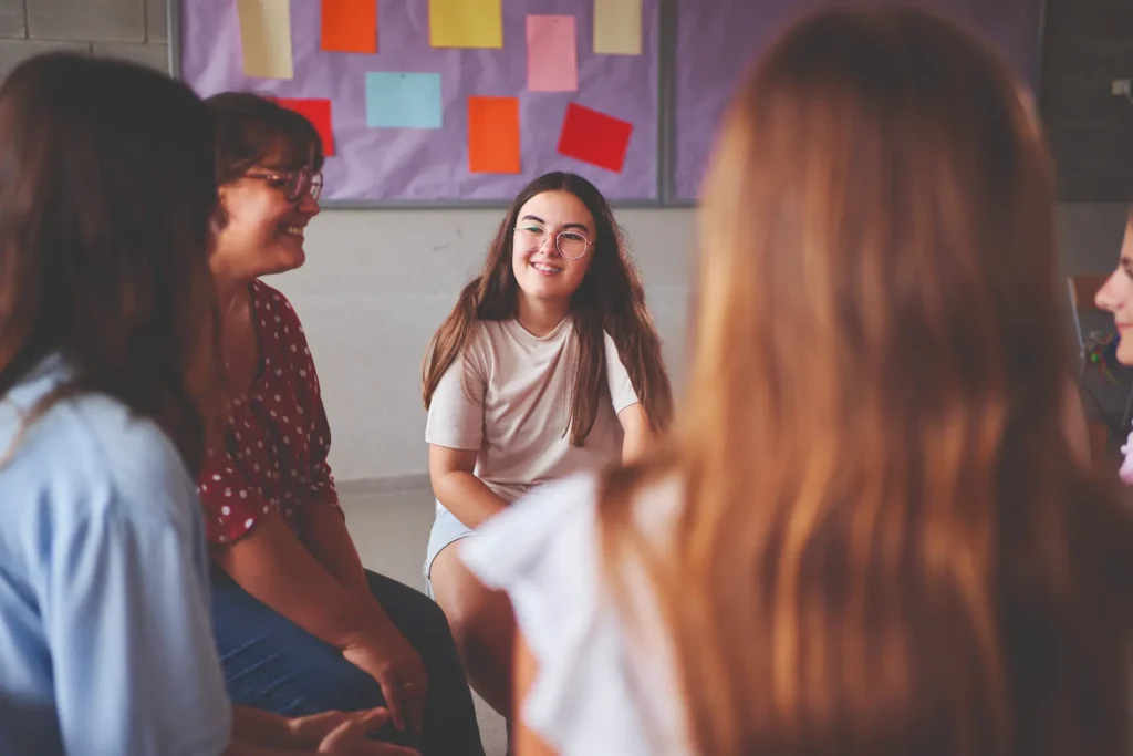 A teacher talking to students in a classroom
